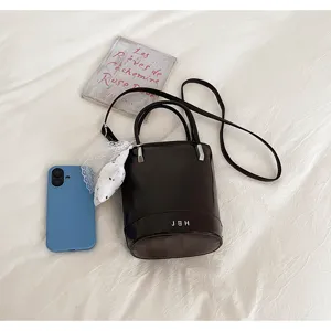 Korean style niche design minimalist bucket bag stylish casual handbag with long strap.