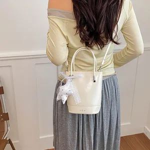 Detailed view of the stylish PU leather bucket bag with cute lace star pendant and handle.