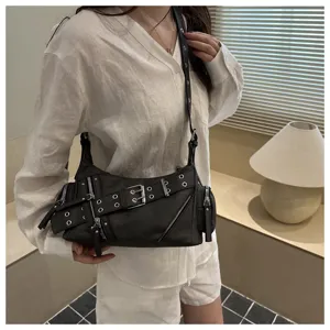 Black retro motorcycle shoulder bag detail, featuring metal buckles, zippers and rivets style.
