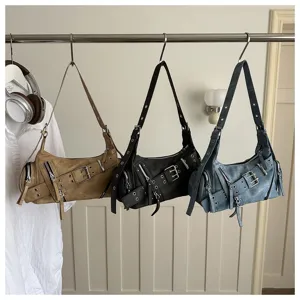 Vintage motorcycle style shoulder bag with multiple buckle straps and edgy grunge design.