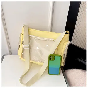 Detail view of the yellow canvas messenger bag with clear front pocket for pins and daily use.