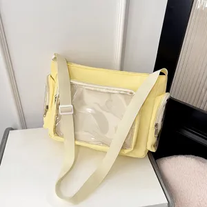 Yellow canvas messenger bag with transparent front pocket, casual crossbody bag for women.