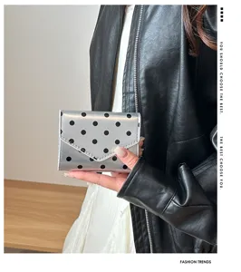 Silver polka dot wallet detail, stylish commute clutch bag, minimalist card holder design.