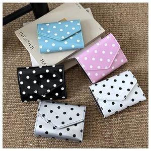 Polka dot folding card holder detail, glossy PU leather surface, multi-color fashion purse.