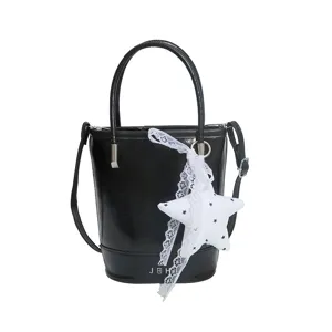 Black PU leather bucket bag with white lace star charm, casual shoulder crossbody bag.