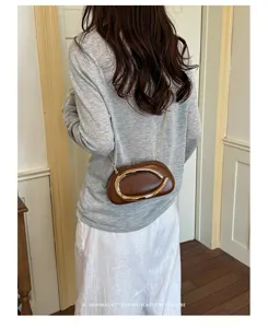 Women fashion chain crossbody shoulder box bag, stylish brown leather design with metal ring detail.