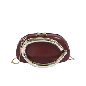 Chic burgundy crossbody shoulder bag for women with luxury metal ring handle and chain strap.