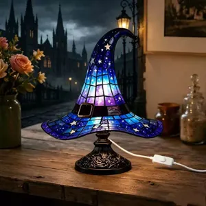 Detailed view of the stained glass witch hat lamp casting a magical glow in a cozy room.