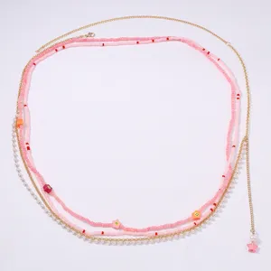 Elegante catena da vita multiclayer con perline gioiello da corpo dorata e rosa