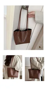 Brown woven leather shoulder bag detail shot, showing the intrecciato pattern and strap.