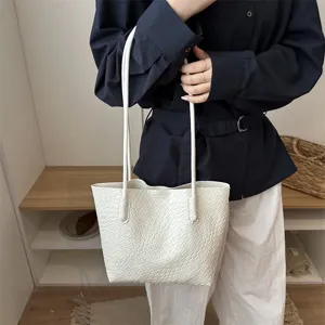 White woven shoulder bag detail view, casual minimalist design for daily fashion wear.