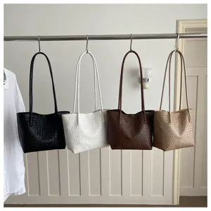 Woven leather shoulder bag large capacity casual minimalist tote bag for women daily commute.