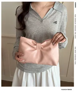 Stylish pink bow clutch bag, minimalist PU leather evening purse for women fashion accessories.