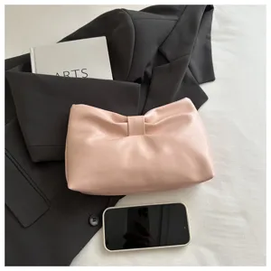 Pink leather bow clutch bag, elegant pleated design for women daily detailed view.