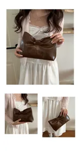 Chic brown leather bow clutch bag for women, elegant minimalist fashion evening handbag.
