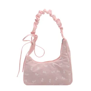 Sweet pink gingham bow print shoulder bag with stylish rucked strap for daily commute.