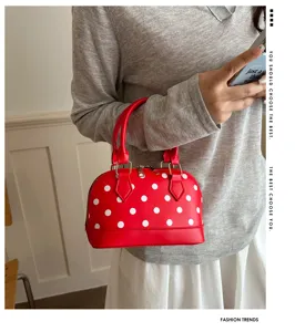 Red polka dot shell handbag, stylish dome crossbody bag with top handles for women.