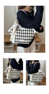Gedetailleerd uitzicht op de zwart-witte houndstooth tote tas, met stijlvolle band en textuur.