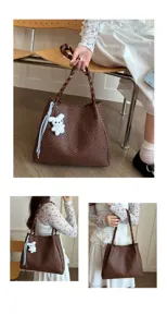 Brown woven shoulder bag detail view showcasing braided strap and cute fluffy bear keychain pendant.