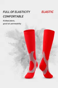 Red compression sports socks with breathable knitted fabric for outdoor running and fitness.