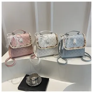 Sweet polka dot mini backpack with cute lace pearl and bunny decor for daily commute.