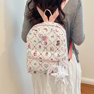 Cute kawaii cartoon print student backpack with pink straps and star pendant for casual daily use.