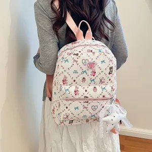 Cute kawaii backpack with sweet cartoon print, pink straps and lace star pendant detail.