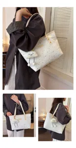 Large capacity commuter tote bag featuring all-over star print and cute cloud pendant.
