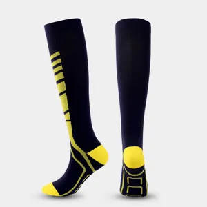 Athletic compression socks for men and women, navy blue with yellow stripes, sports gear.