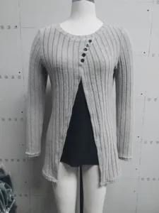 Detail of grey ribbed mock-layer T-shirt with round neck and button accents
