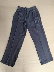 Full view of men's navy blue straight-leg dress pants laid flat on a wooden surface.