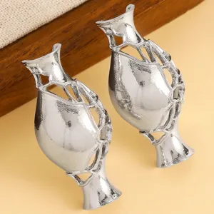 Detailed view of silver artistic flower vase brooches with unique hollow-out design
