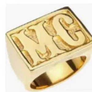 Vintage gold-plated stainless steel men's signet ring featuring embossed MC letters