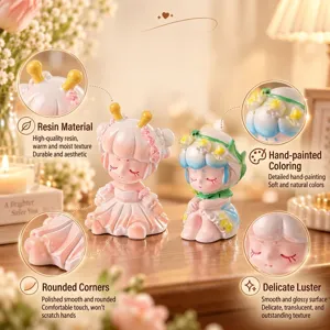 Vue détaillée de deux figurines en résine de fille mignonne, peintes à la main.
