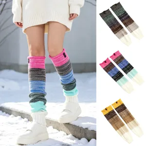 Detailed view of colorful striped knitted leg warmers featuring button accents for winter.