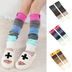 Detail of striped knitted leg warmers with button decor and multiple color options.