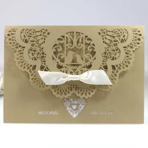 Elegant laser cut wedding invitation card with white satin bow and lace pattern