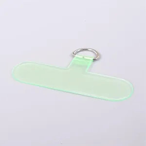 Semi-transparent light green T-shaped PVC phone tether patch with metal D-ring