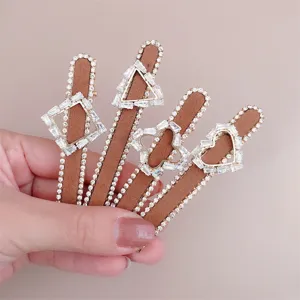 Vintage rhinestone hair clips set, elegant brown fabric barrettes with geometric crystal design.