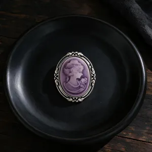 Vintage Victorian style cameo brooch featuring a purple lady portrait with silver frame