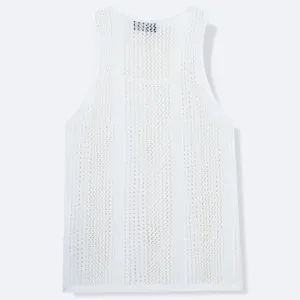 Detailed view of white knitted mesh tank top with hollow-out pattern and deep U-neck