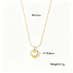 Detailed view of gold heart necklace with shell inlay showing dimensions and weight.