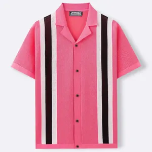 Close-up detail of pink knit short sleeve cardigan with black and white stripes