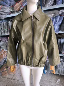Detailed front view of an oversized olive green faux leather motorcycle jacket on a mannequin