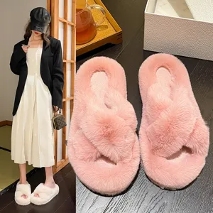 Detail view of plush faux fur cross-strap slippers with thick sole and soft texture for winter