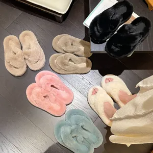 Soft plush criss-cross faux fur slippers available in multiple colors for cozy indoor wear.