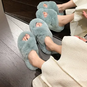 Detail view of plush mint green criss-cross platform slippers for home and outdoor