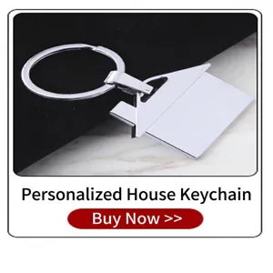 Detailed view of a silver house-shaped metal keychain featuring a polished finish.