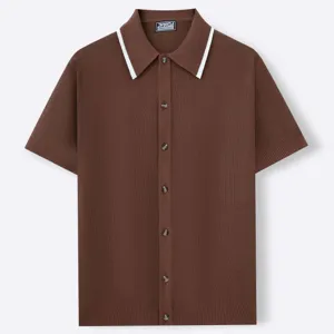 Detail shot of a brown short-sleeved knit Polo cardigan with white tipped collar