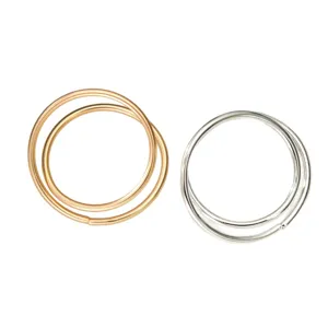 Minimalist double-ring metal napkin holders in gold and silver finishes for table decor